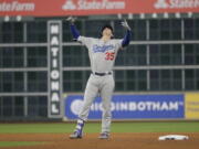 Los Angeles Dodgers’ Cody Bellinger reacts after hitting a double during the seventh inning of Game 4 of baseball’s World Series against the Houston Astros Saturday, Oct. 28, 2017, in Houston. (AP Photo/David J.