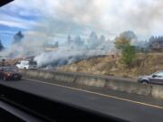 A brush fire on the north shoulder of state Highway 14 near Lieser Road came close to some homes Wednesday afternoon.