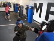 Billimon "Birdy" Billimon of Vancouver, 19, spars with Aaron Mino of Vancouver, 18, during practice at Lord's Gym in Vancouver on Wednesday, Nov. 15, 2017. Birdy has participated in the program throughout the past three years and has encouraged his brother many of his friends to join. ÒLooking back at it, boxing helped me with a lot, like self discipline," he said.