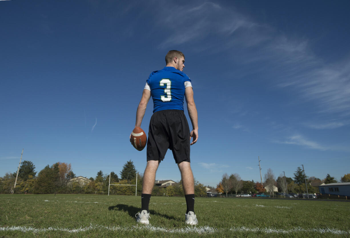 Mountain View High School quarterback Glen Perry Jr. on his team’s practice field Tuesday morning.