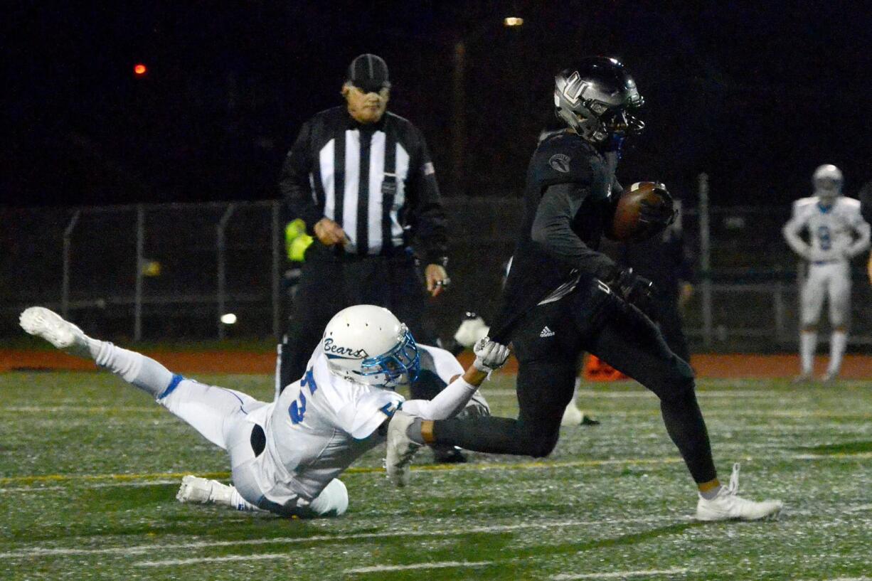 Tahoma defensive back Jerrel Chapman can't stop Union receiver Darien Chase at McKenzie Stadium in Vancouver on Friday, Nov. 3, 2017. Union beat Tahoma 41-14.