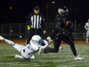 Tahoma defensive back Jerrel Chapman can't stop Union receiver Darien Chase at McKenzie Stadium in Vancouver on Friday, Nov. 3, 2017. Union beat Tahoma 41-14.