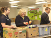 Minnehaha: Trudi Inslee, the state’s first lady, visited the Clark County Food Bank on Oct. 24, helping volunteers pack boxes and prepare ingredients.