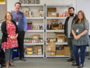 Woodland: A partnership between Woodland Public Schools and Love Overwhelming received a $55,000 grant to provide services to homeless students and their families. From left: Leslie Mohlman, community, family, student resource coordinator for the district; Jake Hall, executive director of learning support and alternatives for the district; Chuck Hendrickson, founder and executive director of Love Overwhelming; and Jill Boaglio, a housing navigator from Love Overwhelming.