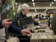 Crystine Jividen of Vancouver scores a copy of Carole King’s classic 1971 album, “Tapestry,” while browsing bins of vinyl at the NW’s Largest Garage Sale & Vintage Sale at the Clark County Event Center at the Fairgrounds on Saturday.