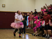 Battle Ground: Students and staff at Firm Foundation Christian School raised money for the National Breast Cancer Foundation during a pep rally and volleyball game.