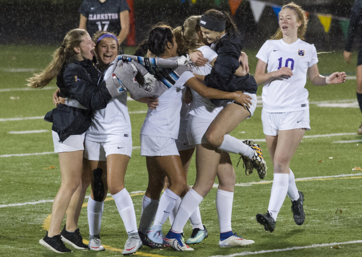 Columbia River girls soccer players celebrate their 2-1 win over Clarkston in the Class 2A state playoffs Wednesday.