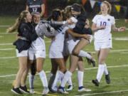 Columbia River girls soccer players celebrate their 2-1 win over Clarkston in the Class 2A state playoffs Wednesday.