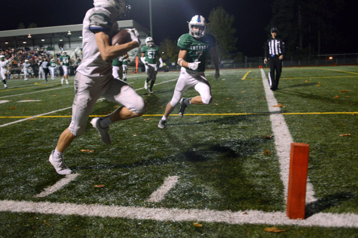 Mountain View defensive back Jack Mertens is unable to stop Peninsula receiver Michael Foreman from scoring the game-winning touchdown during the 3A state playoff game on Saturday at McKenzie Stadium.