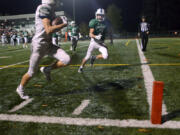 Mountain View defensive back Jack Mertens is unable to stop Peninsula receiver Michael Foreman from scoring the game-winning touchdown during the 3A state playoff game on Saturday at McKenzie Stadium.