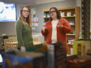 Nova Gump, interim program assistant at the Penguin Pantry at Clark College, left, consults with Natalie M. Shank, assistant director of student care and community standards at Clark College, about food items in the pantry. The Penguin Pantry opened this summer to support currently enrolled Clark College students.