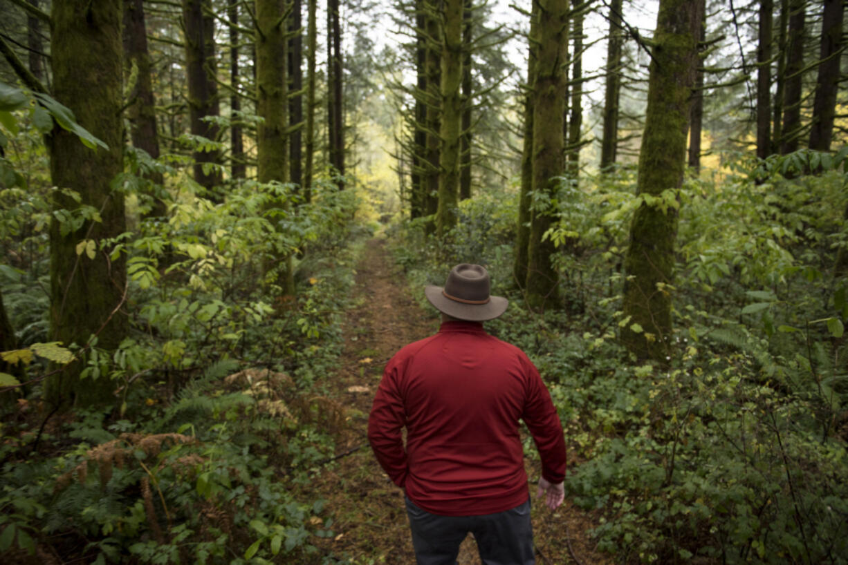 Sean Guard, executive director of the Columbia River Veterans Organization, walks along a trail that he hopes will be the entrance of a new veterans retreat, Camp Eagles Rest, at Bratton Canyon Park near Woodland.