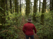 Sean Guard, executive director of the Columbia River Veterans Organization, walks along a trail that he hopes will be the entrance of a new veterans retreat, Camp Eagles Rest, at Bratton Canyon Park near Woodland.