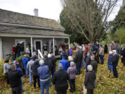 Guests gather to hear speakers at the 150 anniversary celebration for the John Stanger House, the oldest privately built home in the county Sunday.