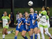 Penguin's Rylee MacDonald (8) leaps for a header during their semi-finals game against Highline College at Starfire Field in Tukwila, WA, on Nov. 10, 2017. The Thunderbirds beat the Penguins by one penalty kick after going 2-2 in double overtime.