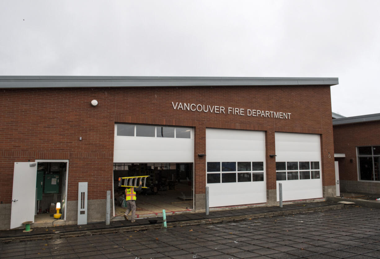 JH Kelly electrician Chris Lee works on setting up the electrical system at Vancouver’s new Fire Station 1 on Wednesday afternoon.