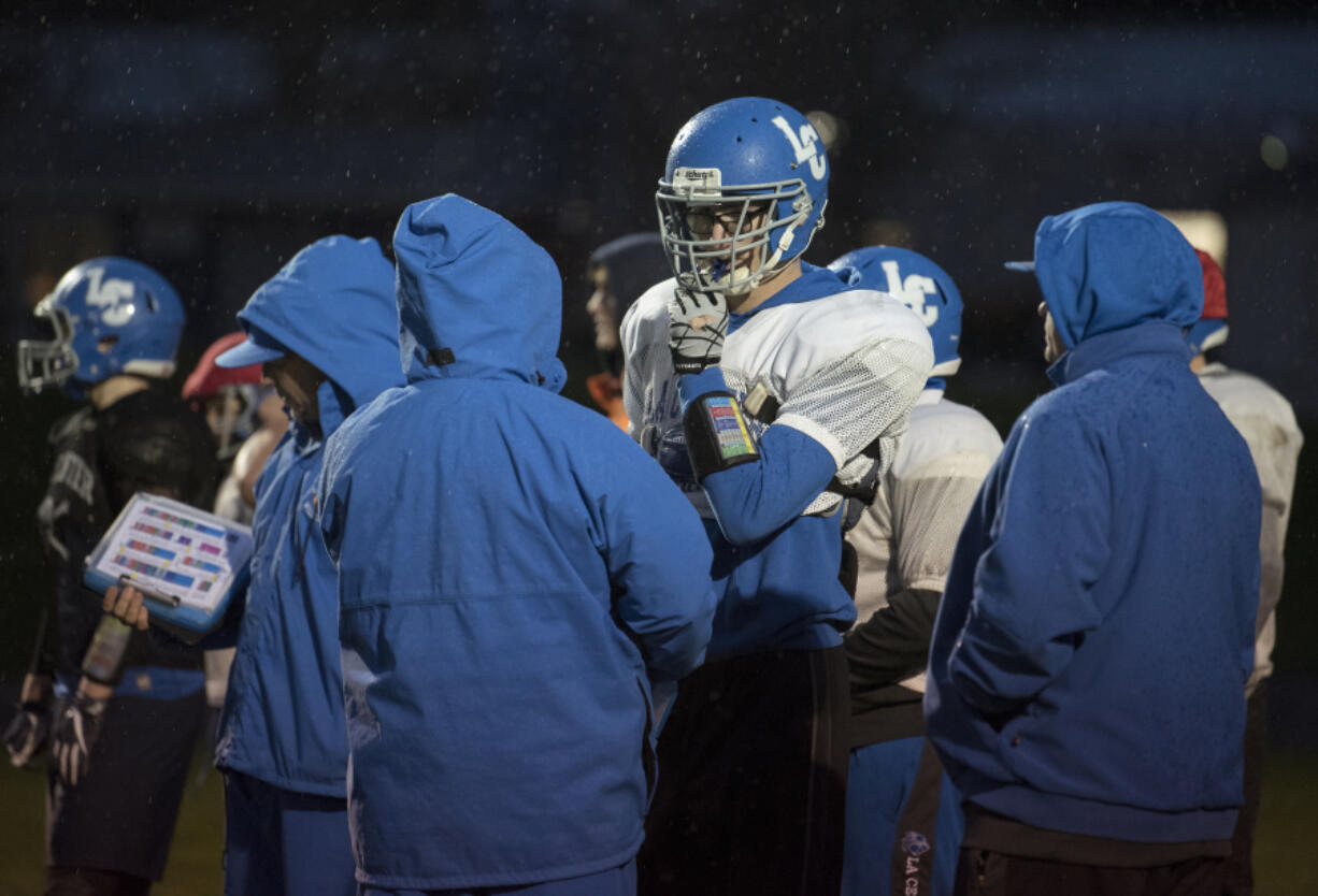 At 6-foot-7, La Center senior Wyatt Siebert, center, has been a menace to opposing quarterbacks on the defensive line, earning league co-defensive player of the year honors.