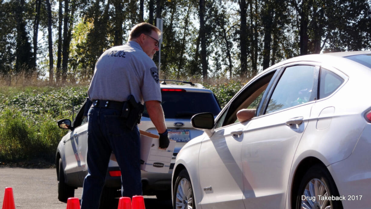 Washougal: Washougal police officer Jon Cotton participates in the city’s Drug Take Back event, a partnership between the Washougal Police Department and Drug Enforcement Administration.