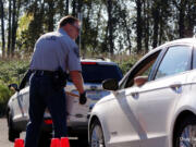 Washougal: Washougal police officer Jon Cotton participates in the city’s Drug Take Back event, a partnership between the Washougal Police Department and Drug Enforcement Administration.