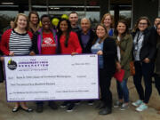 North Garrison Heights: Representatives from the renovated Planet Fitness present a check to members of the Boys & Girls Clubs of Southwest Washington at the gym’s reopening.