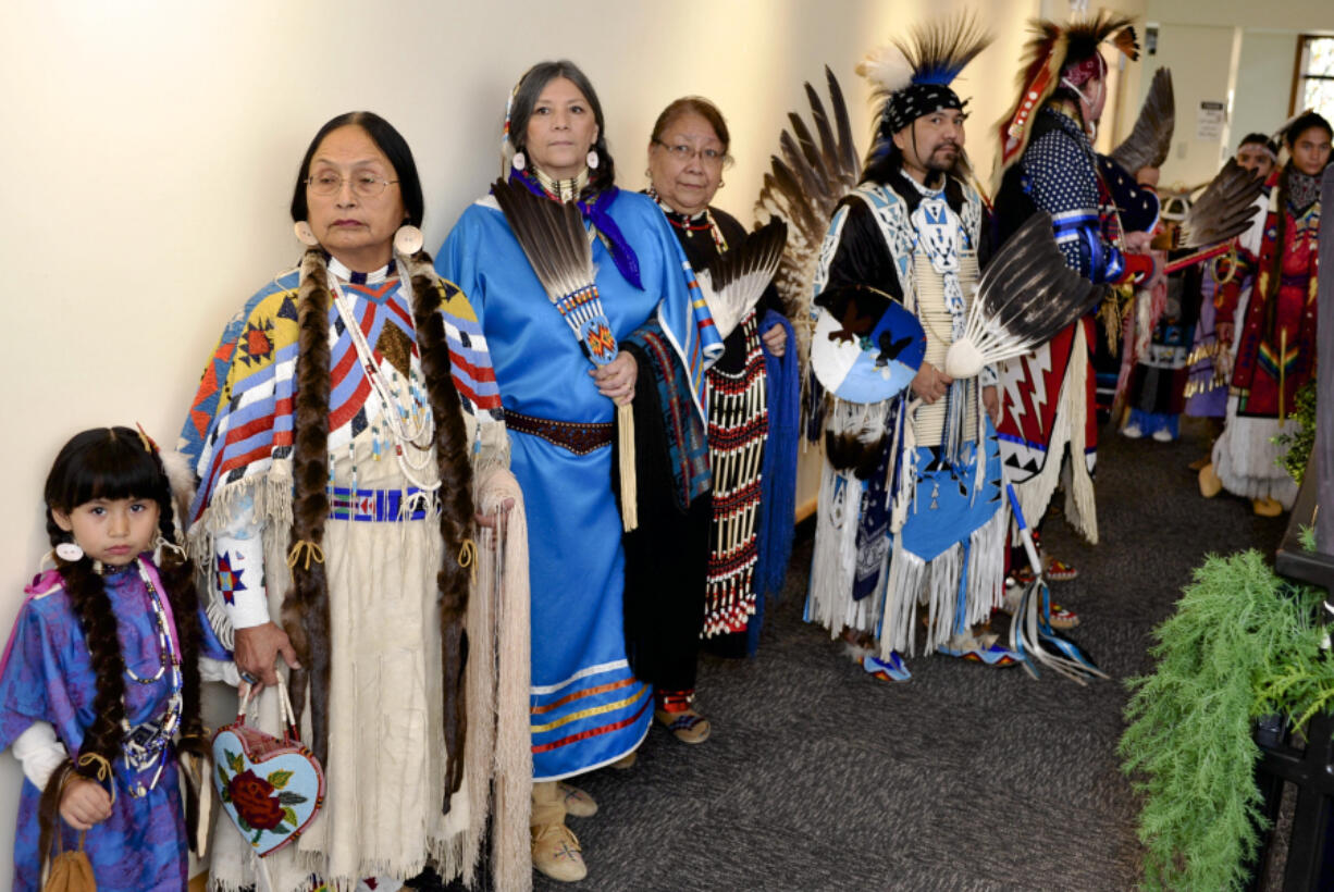 Dancers in Native American regalia wait to perform at the Native American Indian Heritage Festival at the Water Resources Education Center in Vancouver on Saturday.