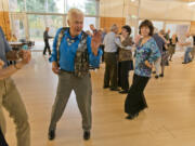 Mark Melchert and Judy Bealer dance at one of the city parks and recreation department’s regular 50 and Better dances Sunday at the Firstenburg Community Center.