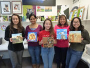 Students at Medallion Art School show off the artworks they created to donate to today’s Art4Art fundraiser at the Vancouver Community Library.