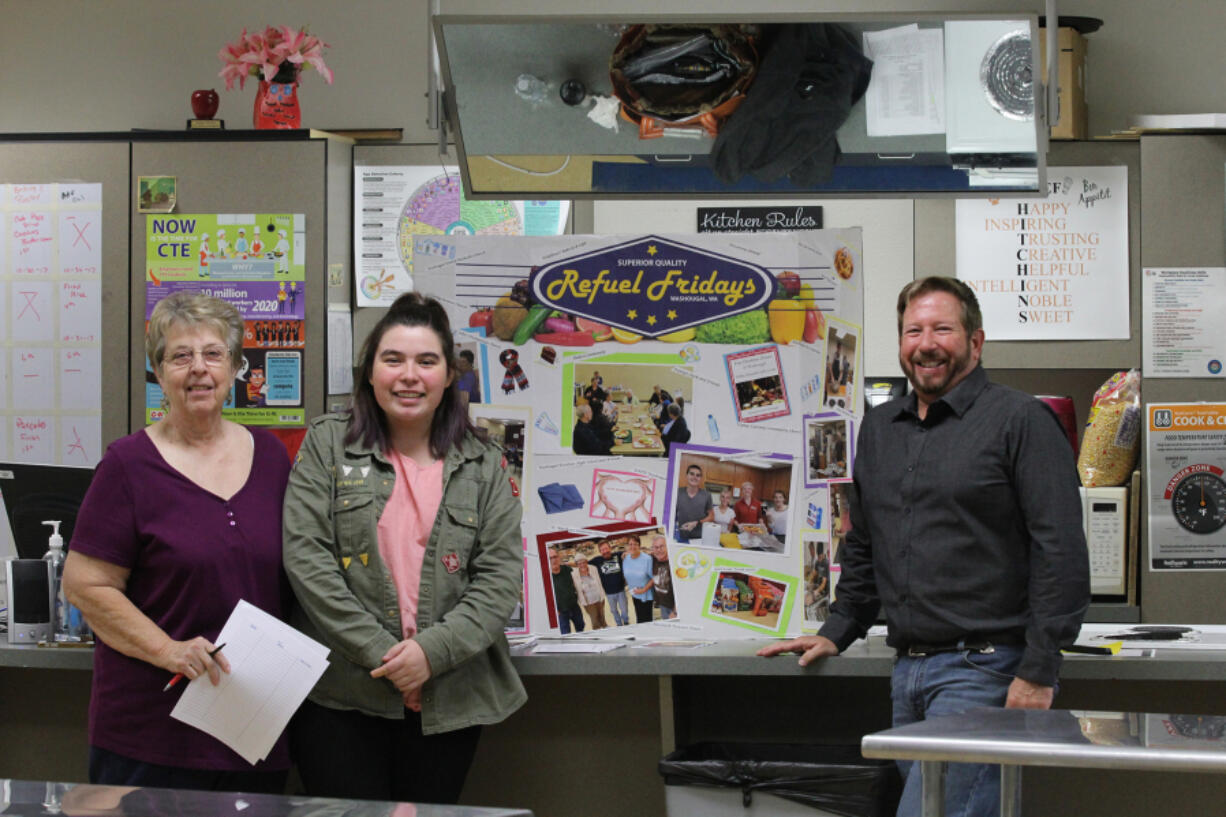 Washougal: Pam Clark, from left, Shayla Rae Tyner and Bob Barber from Refuel Friday at Washougal High School’s “Be the Change” Day on Nov. 1, where students learned about ways to give to the community.