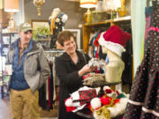 Tom and Alisa Brossia shop at Most Everything Vintage on Saturday in downtown Vancouver to support the Small Business Saturday movement. The campaign, launched in 2010 by American Express, encourages people to shop local the day after Black Friday.