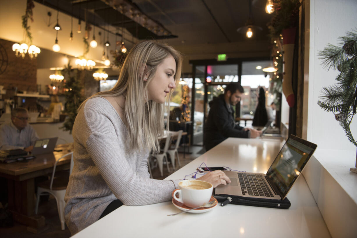 While coffee shops weren’t a category in rating the most hipster city, there’s arguably few things more Bohemian than sipping an espresso drink like the one Lanie Strauss enjoys here while studying Tuesday at Compass Coffee in downtown Vancouver.