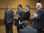 Robert Sabo, left, Sabo’s attorney Erin McAleer, Kris Greene’s attorney Lawrence Merrifield and Port of Vancouver commissioner candidate Kris Greene during an earlier hearing before Clark County District Court Commissioner Todd George on Oct. 18.