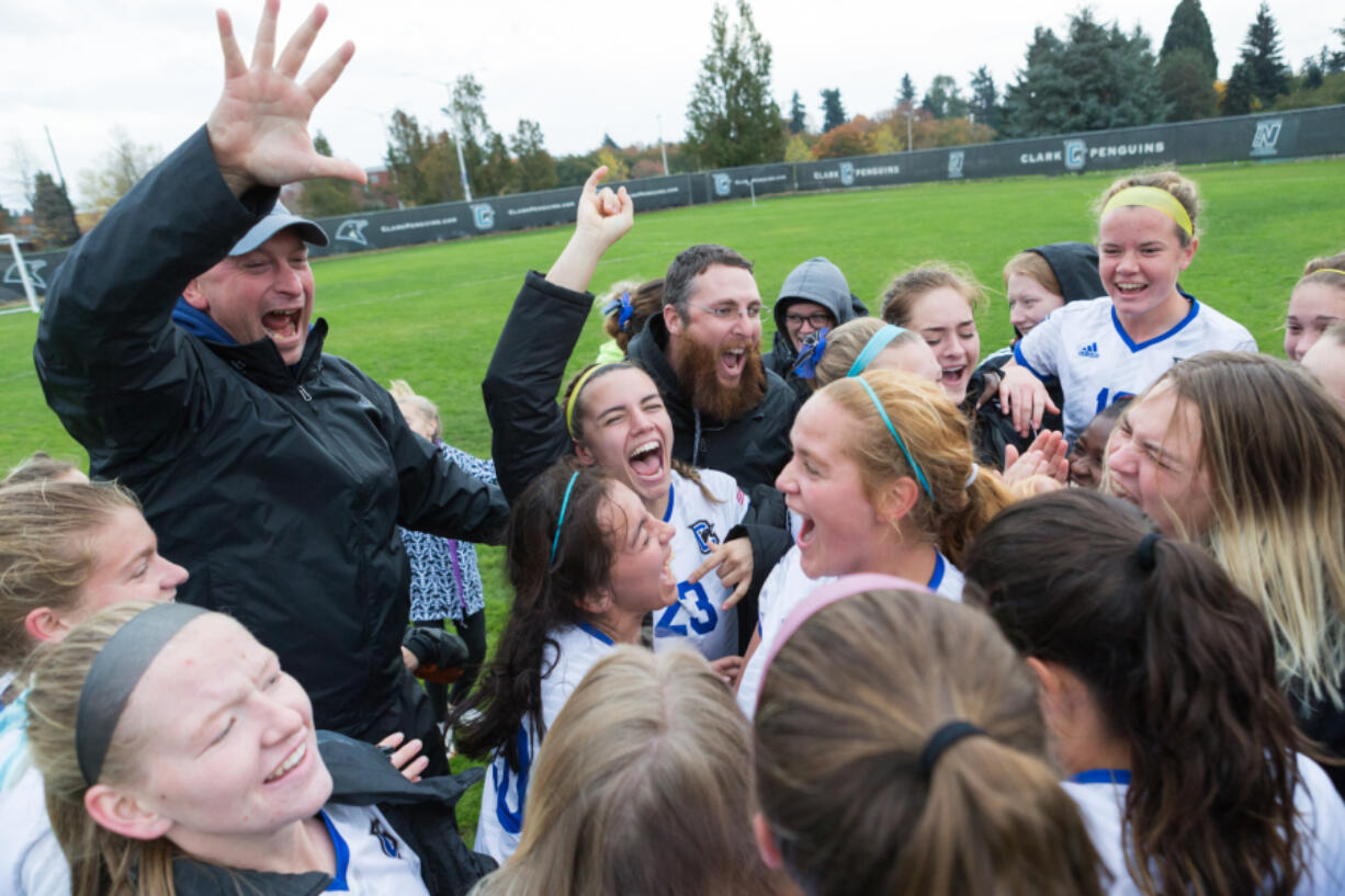 Clark’s women’s soccer team celebrate after beating Whatcom Community College 6-1 after their game at Clark College on Nov. 4, 2017.