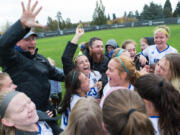 Clark’s women’s soccer team celebrate after beating Whatcom Community College 6-1 after their game at Clark College on Nov. 4, 2017.