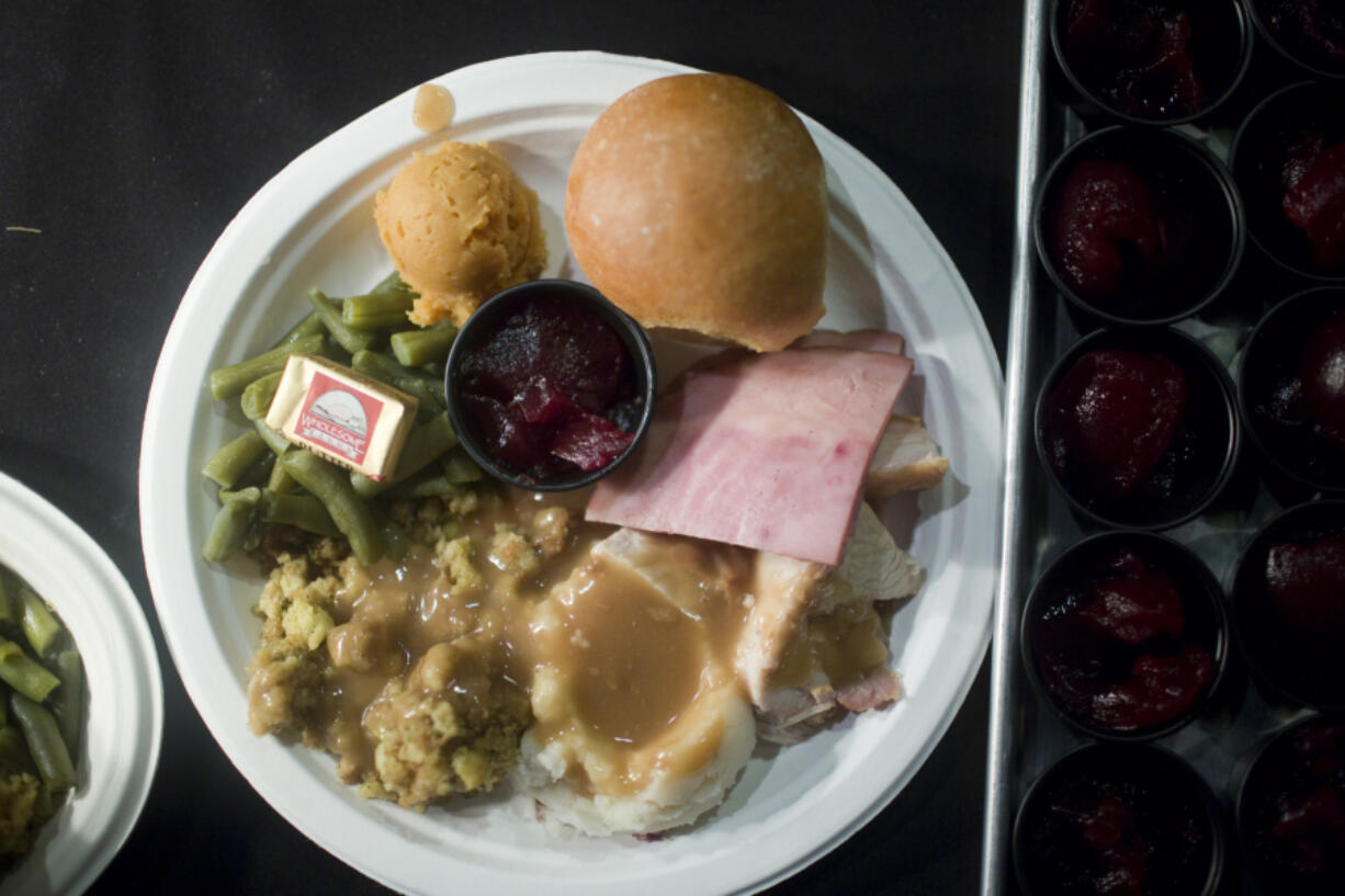 Free Thanksgiving dinner in 2016 at WareHouse ’23. Organizers of the popular dinner have revived the long-standing tradition to again serve those in need. The dinner, which began in 1982, started as a collaboration between the Chronis family and former Clark County Judge Rich Melnick.