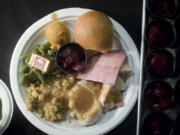 Free Thanksgiving dinner in 2016 at WareHouse ’23. Organizers of the popular dinner have revived the long-standing tradition to again serve those in need. The dinner, which began in 1982, started as a collaboration between the Chronis family and former Clark County Judge Rich Melnick.