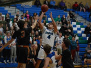 Mountain View’s Alex Hegel (4) scores against Washougal on Monday at Mountain View High School. Hegel scored 22 points to lead the Thunder to a 77-72 season-opening win.