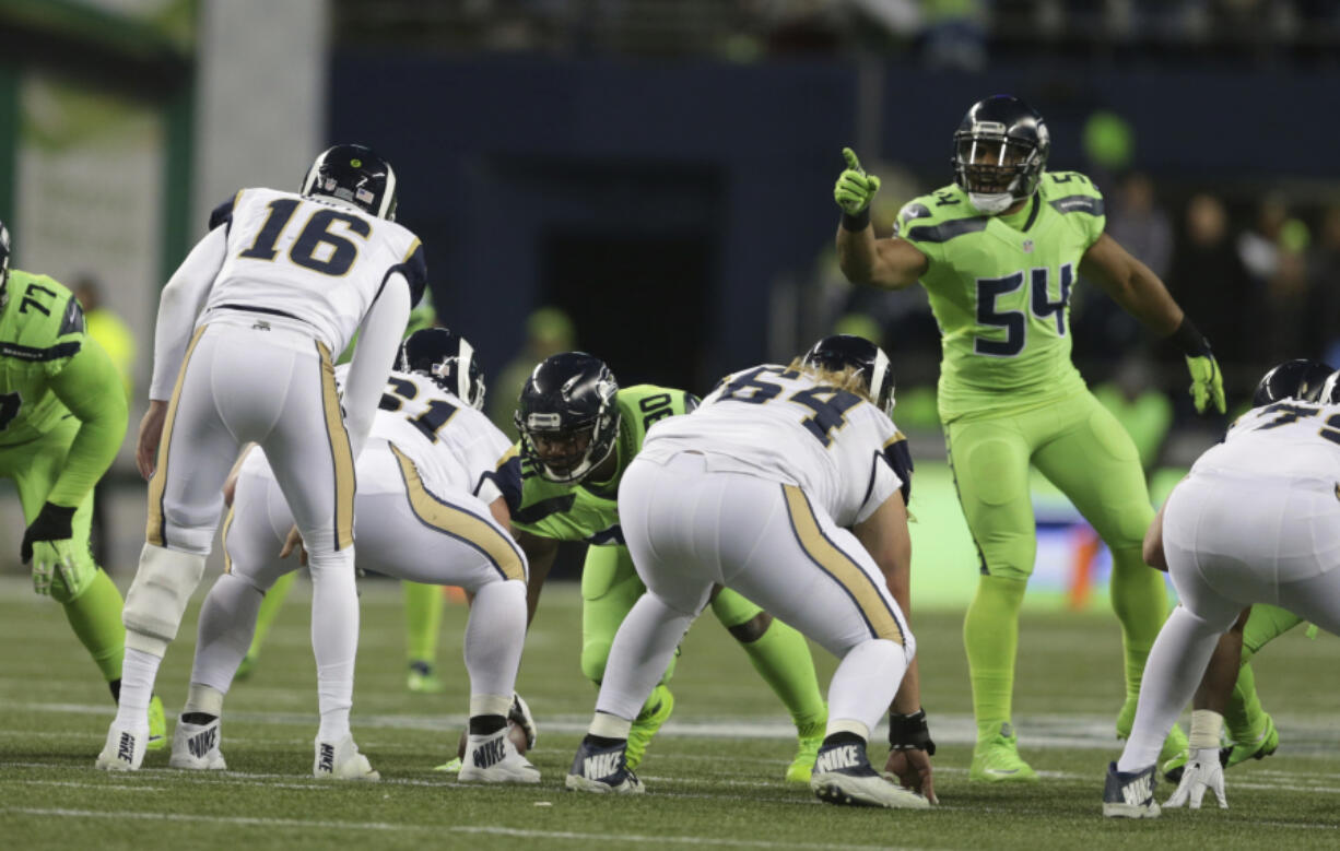 Seattle Seahawks Bobby Wagner (54) is making a case to become only the third middle linebacker since 2003 to win the NFL’s defensive player of the year award.