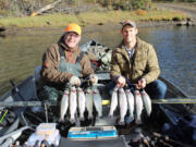 Terry Otto (left) and Wade Ramsey show off a nice catch of rainbow trout taken in Rowland Lake near Lyle, about 80 miles east of Vancouver. Most anglers at the lake did very well during the Black Friday statewide fall trout opener on Nov. 24.