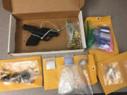 Heroin, methamphetamine and a semi-automatic handgun were recovered at an east Vancouver home early on Wednesday. Three people were arrested at the scene.