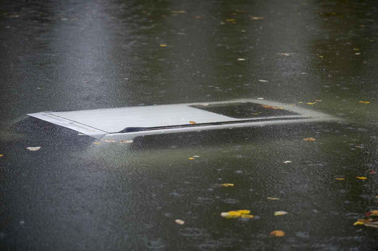 A vehicle is submerged in the water near a boat ramp north of Frenchman's Bar Regional Park on Wednesday morning.