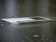 A vehicle is submerged in the water near a boat ramp north of Frenchman's Bar Regional Park on Wednesday morning.