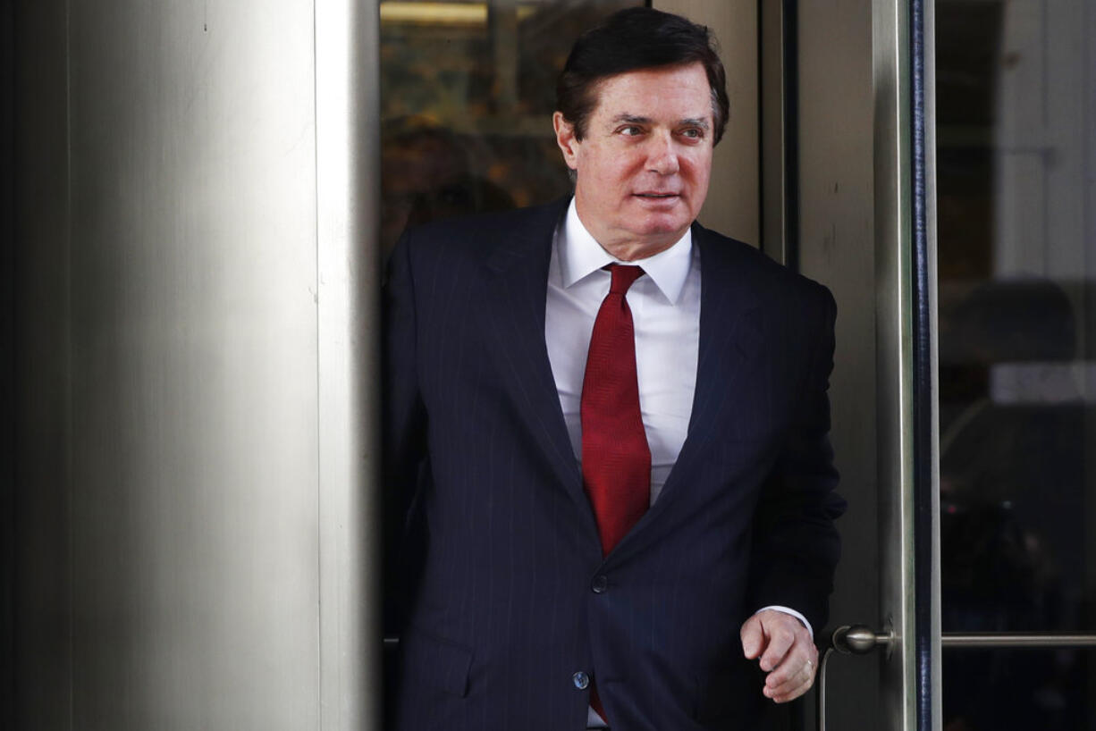 In this Nov. 6, 2017 photo, Paul Manafort, President Donald Trump's former campaign chairman, leaves the federal courthouse in Washington. Manafort and his deputy, Rick Gates, who were charged with violating federal money laundering, foreign lobbying and banking laws for behavior occurring as far back as 2012, have pleaded not guilty.