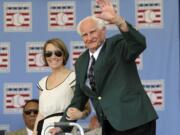 Hall of Famer Bobby Doerr waves during Baseball Hall of Fame induction ceremonies in Cooperstown, N.Y., in July 2011. Doerr, a Hall of Fame second baseman who was dubbed the "silent captain" by longtime Red Sox teammate and life-long friend Ted Williams, has died. He was 99.