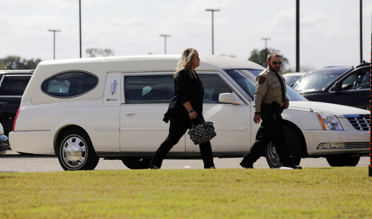 Mourners arrive at the Floresville Event Center to attend a funeral for members of the Holcombe family who were killed in the Sutherland Springs Baptist Church shooting, Wednesday, Nov. 15, 2017, in Floresville, Texas. A man opened fire inside the church in the small South Texas community Sunday, Nov. 5, killing more than two dozen.