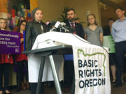 Elliot Yoder, 16, a transgender student at Dallas High School in Dallas, Ore., speaks at a news conference held by ACLU Oregon and Basic Rights in Portland, Ore., Thursday, Nov. 16, 2017, to protest a federal lawsuit filed against the Dallas School District over its policy on the treatment of transgender students. The district began allowing Yoder to use the boys' locker room and boys' restrooms after he publicly identified as transgender.