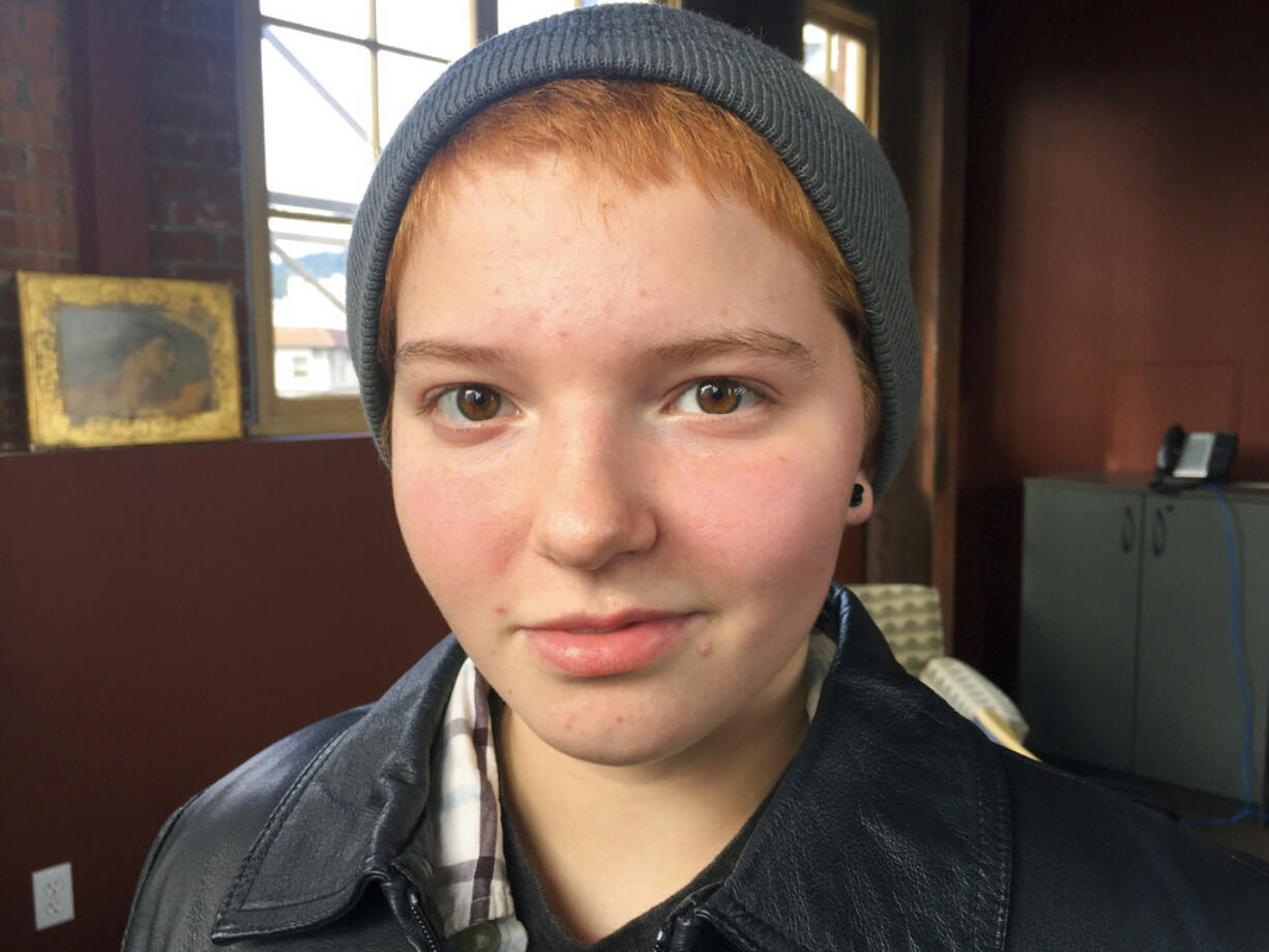 Elliot Yoder, 16, a transgender student at Dallas High School in Dallas, Ore., poses for a photo after a news conference held by ACLU Oregon and Basic Rights in Portland, Ore., Thursday, Nov. 16, 2017, to protest a federal lawsuit filed against the Dallas School District over its policy on the treatment of transgender students. The district began allowing Yoder to use the boys' locker room and boys' restrooms after he publicly identified as transgender.