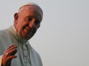 Pope Francis gestures as he visits the National Martyrs’ Memorial of Bangladesh in Savar, outskirts of Dhaka, Bangladesh, on Thursday. Pope Francis arrived in Bangladesh Thursday for the second leg of his six-day trip to Asia. (AP Photo/A. M.