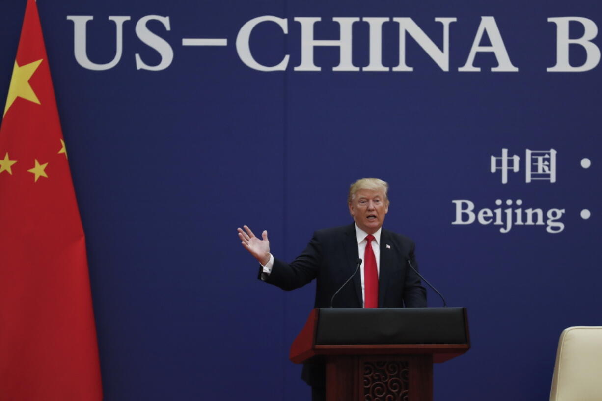 U.S. President Donald Trump speaks during a business event with Chinese President Xi Jinping at the Great Hall of the People in Beijing on Thursday. Trump is on a five-country trip through Asia traveling to Japan, South Korea, China, Vietnam and the Philippines.