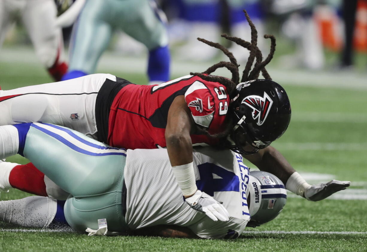 Falcons defensive end Adrian Clayborn records the fifth sack of Cowboys quarterback Dak Prescott during the second half in a NFL football game on Sunday, Nov. 12, 2017, in Atlanta. The Falcons beat the Cowboys 27-7.