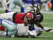 Falcons defensive end Adrian Clayborn records the fifth sack of Cowboys quarterback Dak Prescott during the second half in a NFL football game on Sunday, Nov. 12, 2017, in Atlanta. The Falcons beat the Cowboys 27-7.